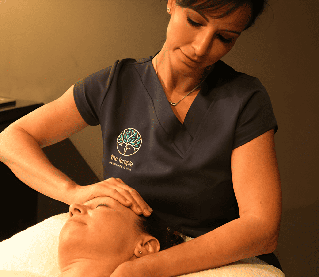 Temple Skin Care & Spa therapist performing a relaxing facial treatment for a client